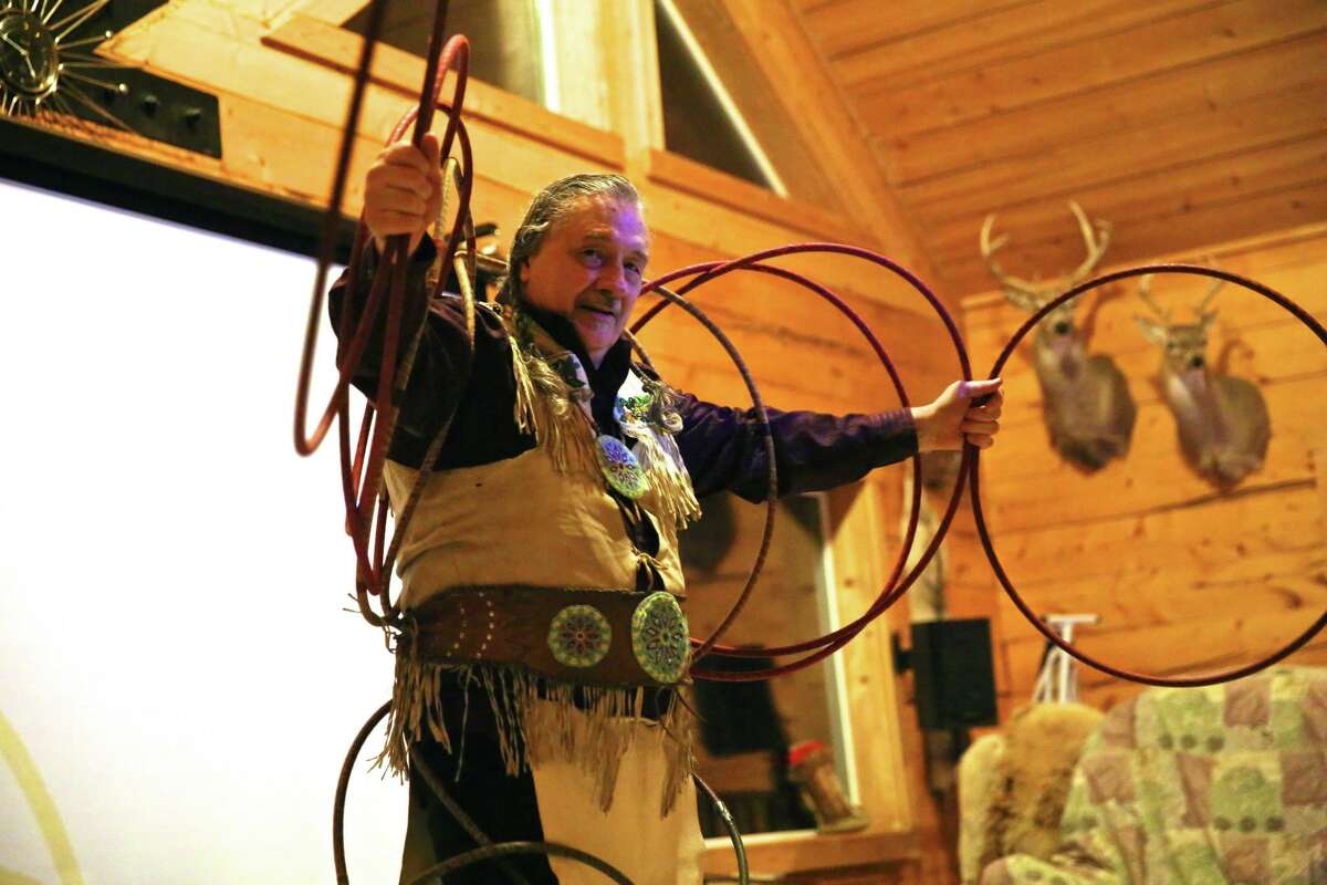 Ben Boyd﻿ performs a traditional American Indian hoop dance in a Paradise Valley, Alaska, lodge for tourists waiting to see the northern lights.