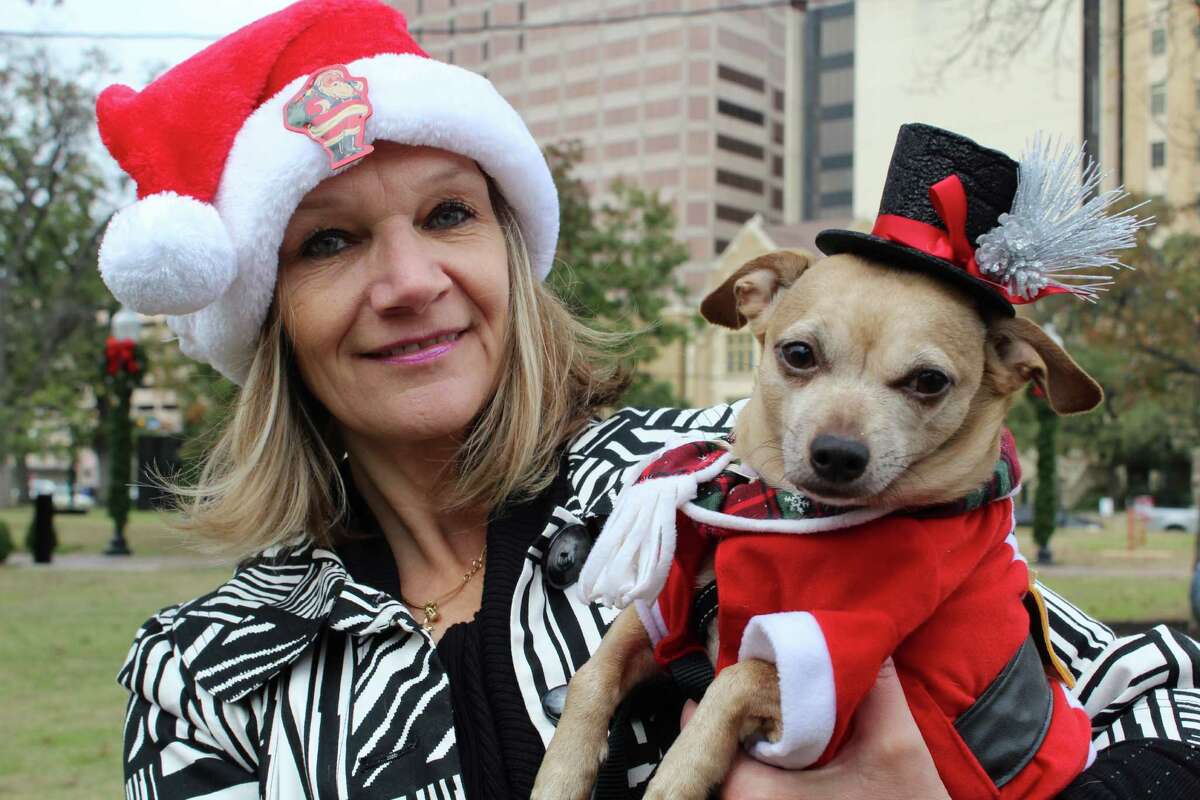 Pets and their humans showed up in holiday gear at Travis Park for the SA Urban Pet Market. The event included dog grooming, gifts for pets and a blessing of the animals.