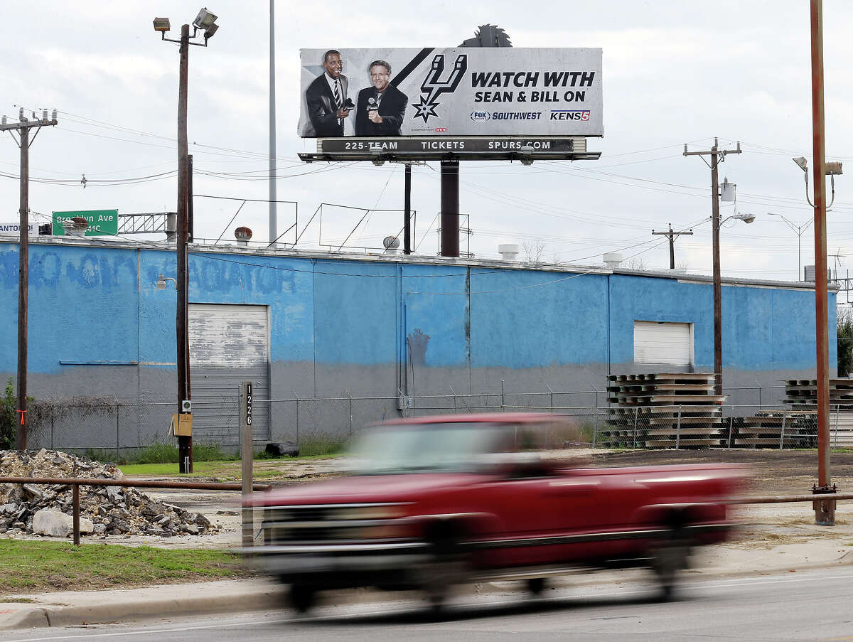 Detail photo of billboard with Sean Elliott and Bill Land Sunday Dec. 14, 2014.
