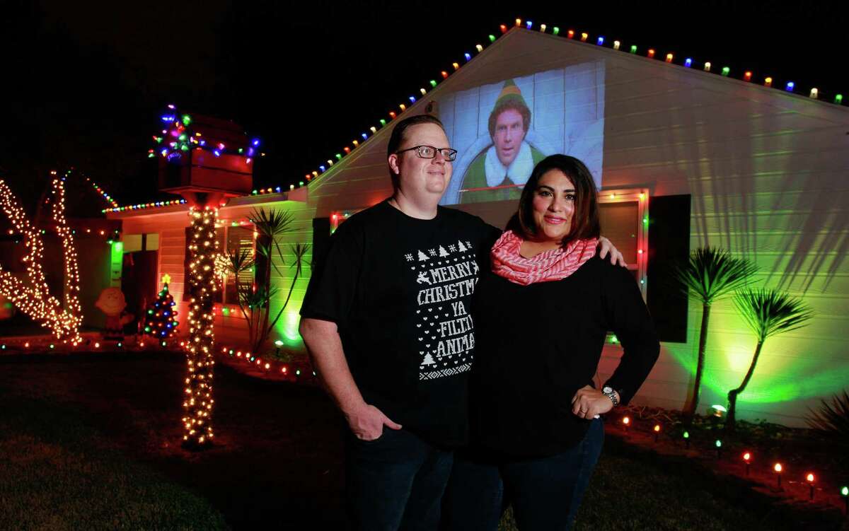 ﻿Matt and Rosie Davis have decorated their house this year with a movie projector that shows Christmas films, like "Elf."