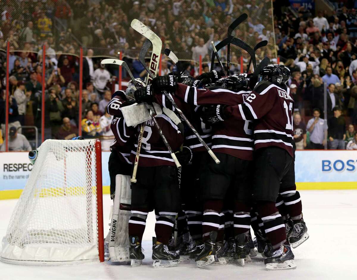 PHILADELPHIA, PA - APRIL 10: The Union College Dutchmen celebrate the win over the Boston College Eagles during the 2014 NCAA Division I Men's Hockey Championship Semifinal at Wells Fargo Center on April 10, 2014 in Philadelphia, Pennsylvania.Union College defeated Boston College 5-4. (Photo by Elsa/Getty Images) ORG XMIT: 464911393