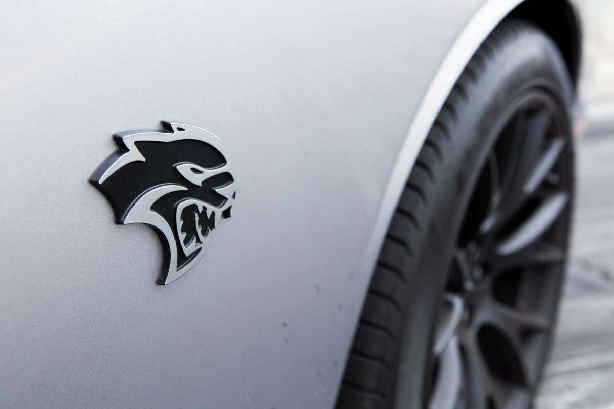 View of the 2015 Dodge Challenger SRT Hellcat logo on the front right side ...