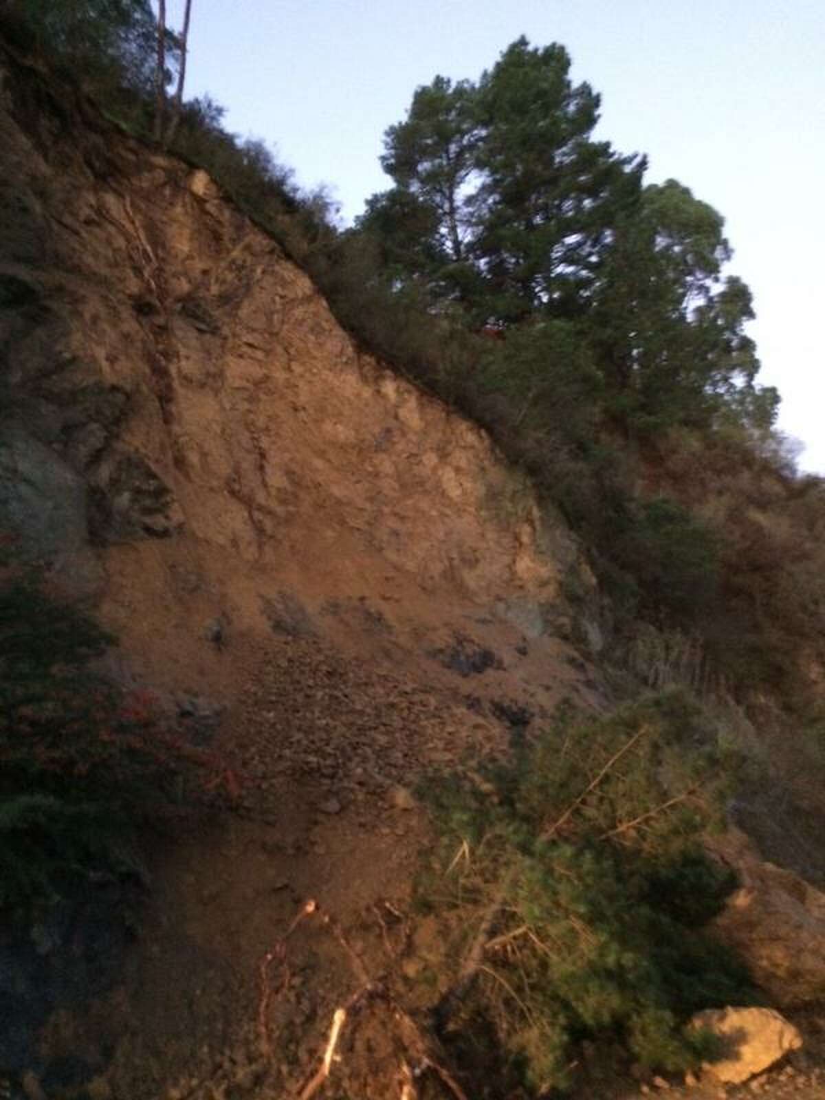 A hillside gave way in Sausalito early Monday morning spilling earth, rocks and mud across two southbound lanes of Highway 101.