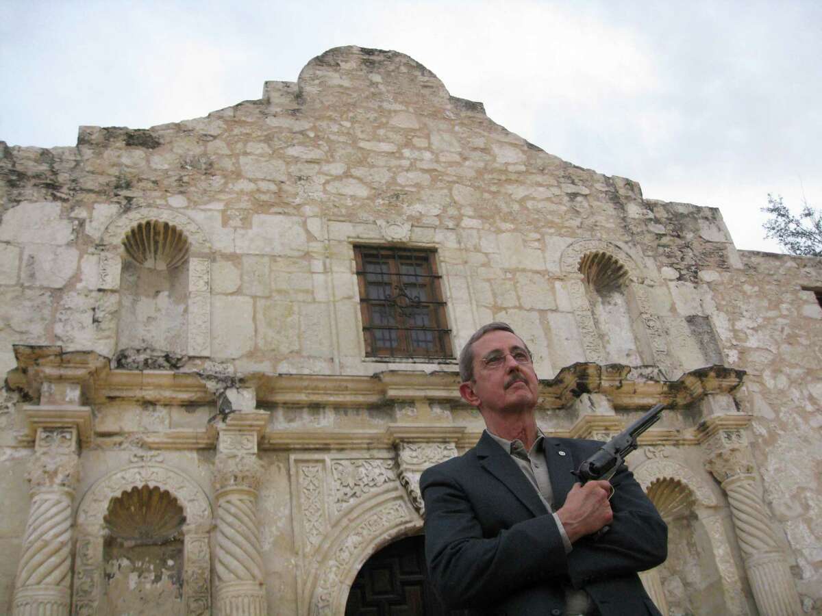 Former Land Commissioner Jerry Patterson poses outside the Alamo on Dec. 22, 2014.