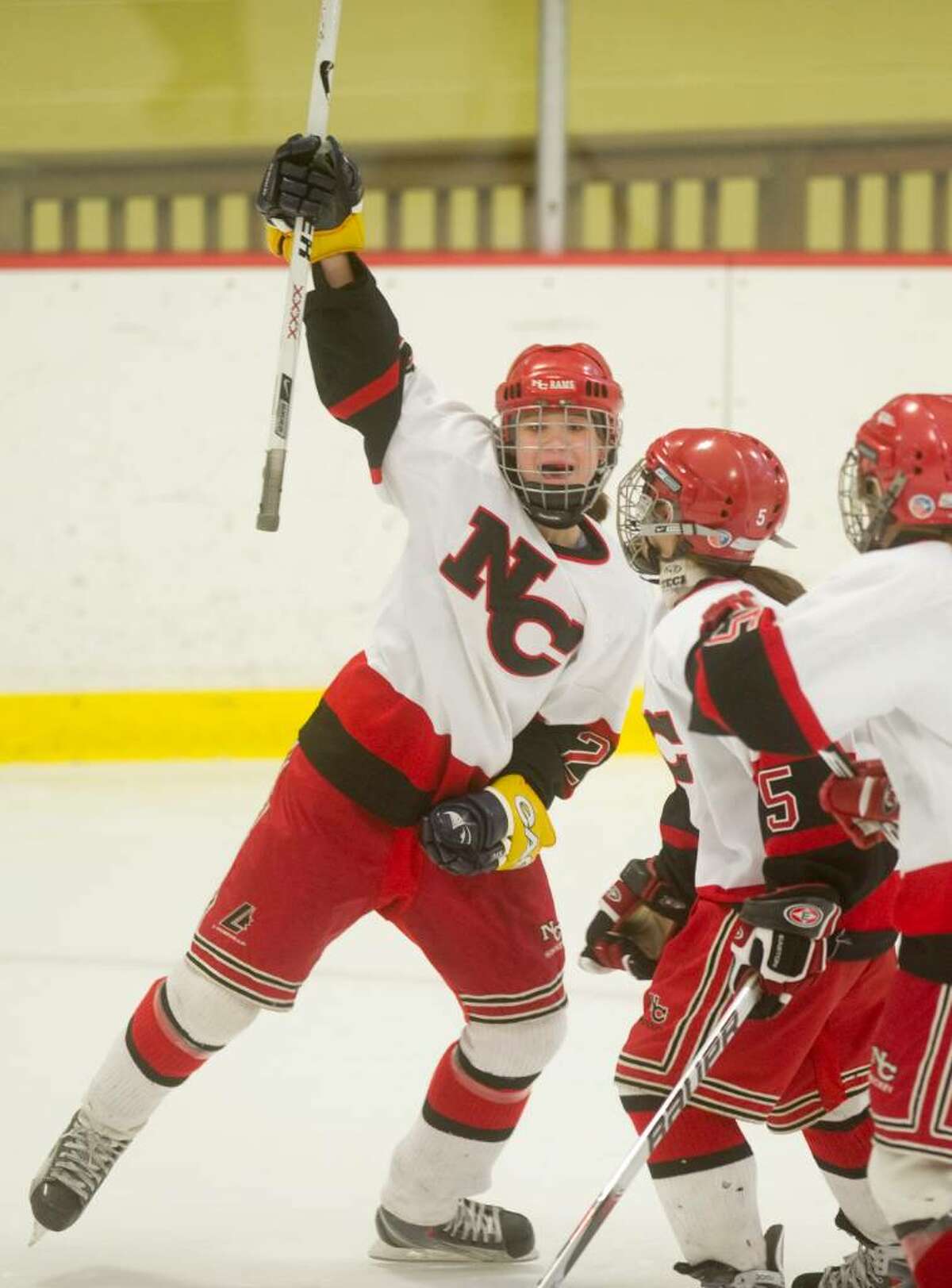 New Canaan's Olivia Hompe celebrates after scoring the Rams' first goal during the FCIAC girls hockey championship at Terry Conners Rink in Stamford, Conn. on Saturday, Feb. 27, 2010.