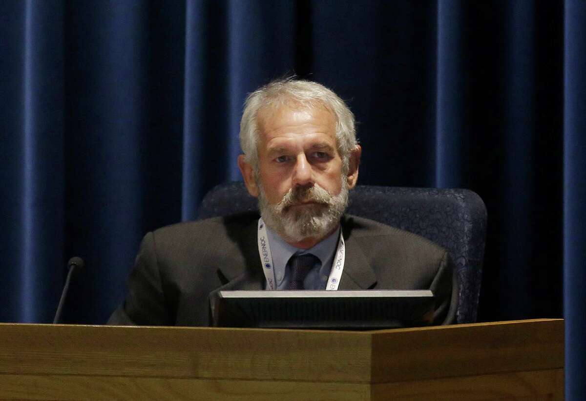 California Public Utilities Commissioner Michael Picker listens to speakers during a meeting of the five-member commission in San Francisco, Thursday, Dec. 18, 2014. (AP Photo/Jeff Chiu)