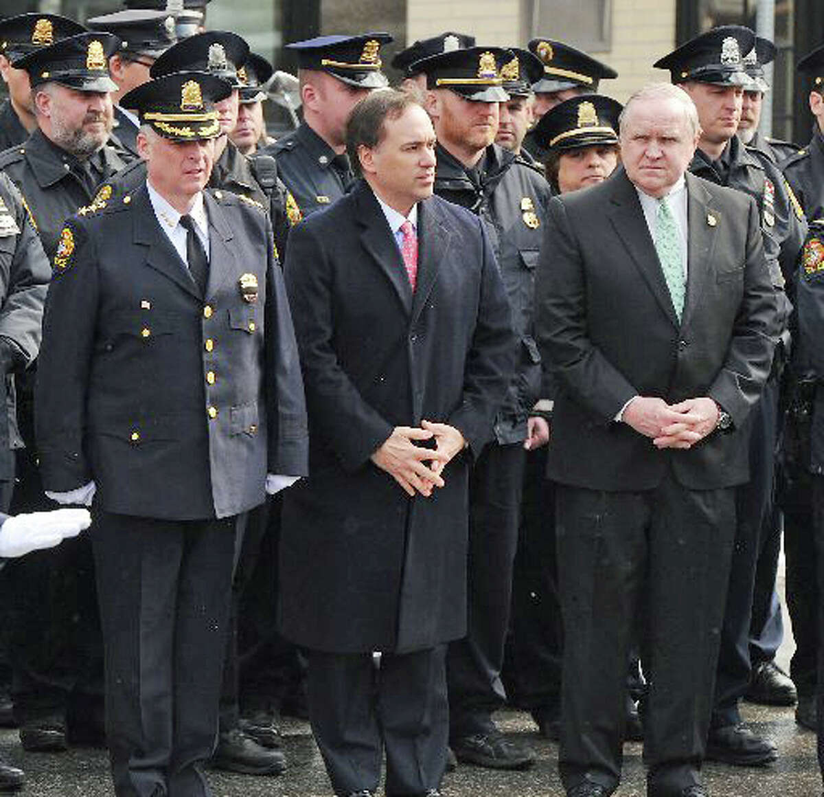 From left, Greenwich Police Chief, James Heavey, Greenwich First Selectman, Peter Tesei and Greenwich Selectman David Theis during the funeral for Greenwich Police Sgt. Roger Petrone at St. Mary Church, Greenwich, Wednesday morning, Feb. 26, 2014. Petrone died Thursday at age 44 after a seven year battle with amyotrophic lateral sclerosis, also known as Lou Gehrig's disease.
