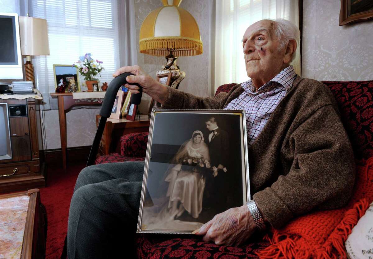 Peter A. Setaro Sr., a life-long Danbury, Conn. resident will turn 105 on March 31. In his lap is his wedding photograph, when he was married to Agnes in 1930.