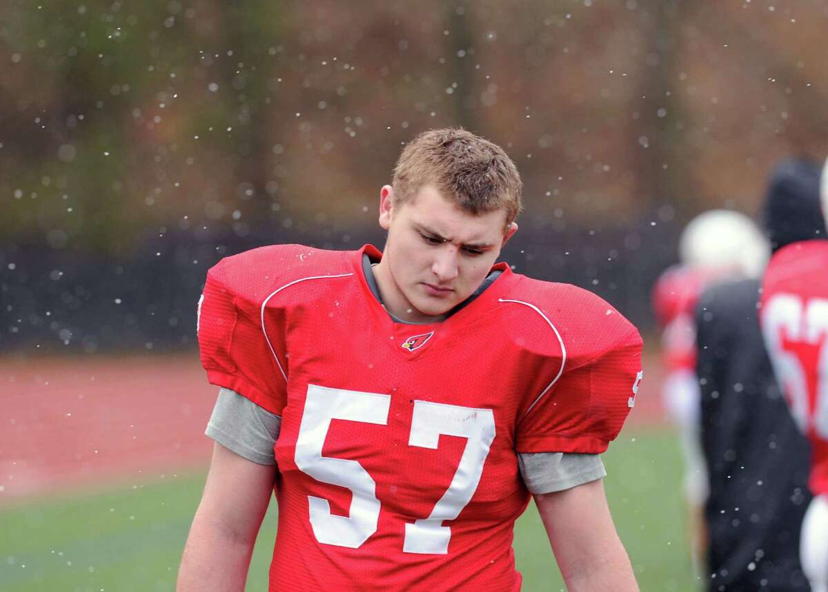 Jake Herman of Greenwich (#57) at the conclusion of the Thanksgiving Day high school football game between Greenwich High School and Staples High School at Greenwich, Conn., Thursday, Nov. 27, 2014. Staples defeated Greenwich by a score of 38-21.
