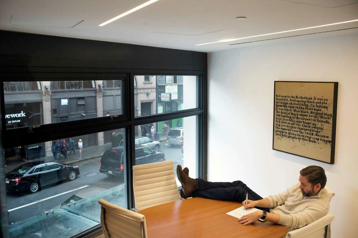 Artis Ventures co-founder Mike Harden works in one of the rooms of the company’s new office in the San Francisco, Calif. on Wednesday, December 17, 2014. The company recently moved to the Mid-Market neighborhood to the Warfield building, a historic office building that was vacant a few years ago but is now home to several companies, including Benchmark Capital, Spotify and Match.com.