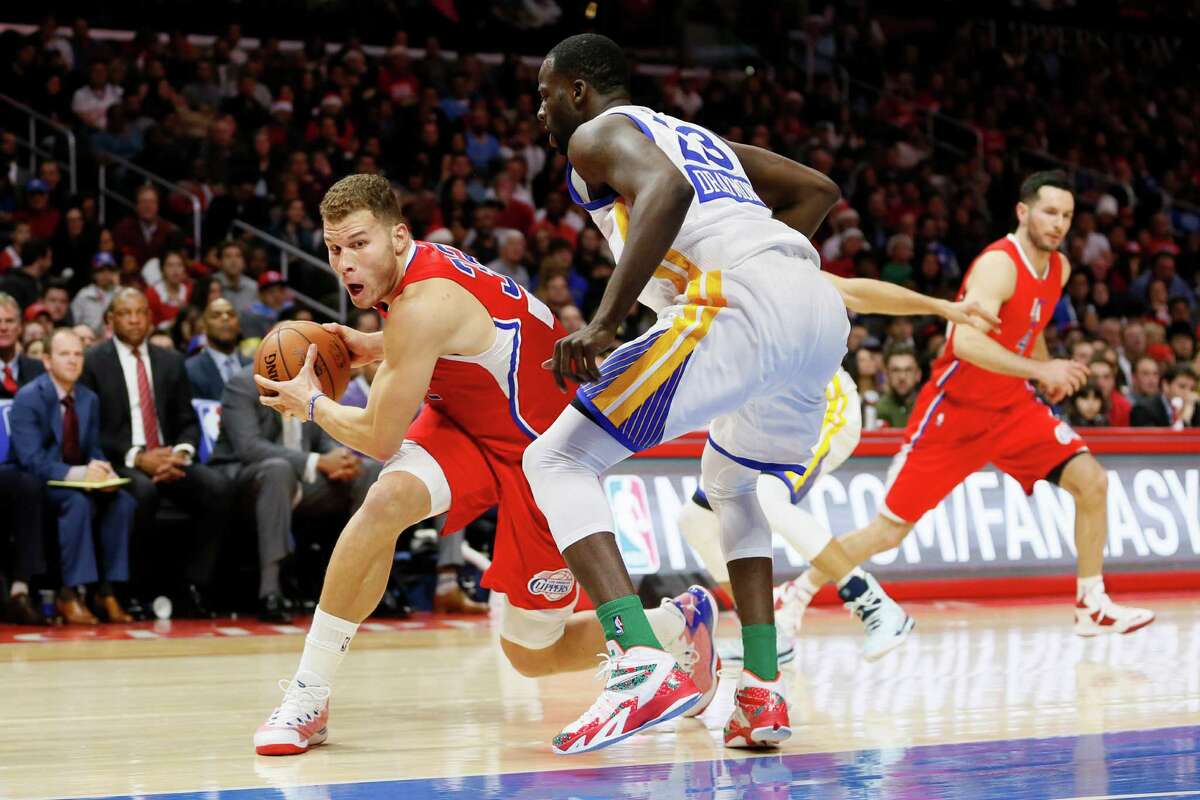 Blake Griffin’s size was too much for the Warriors’ front line, including Draymond Green (right).