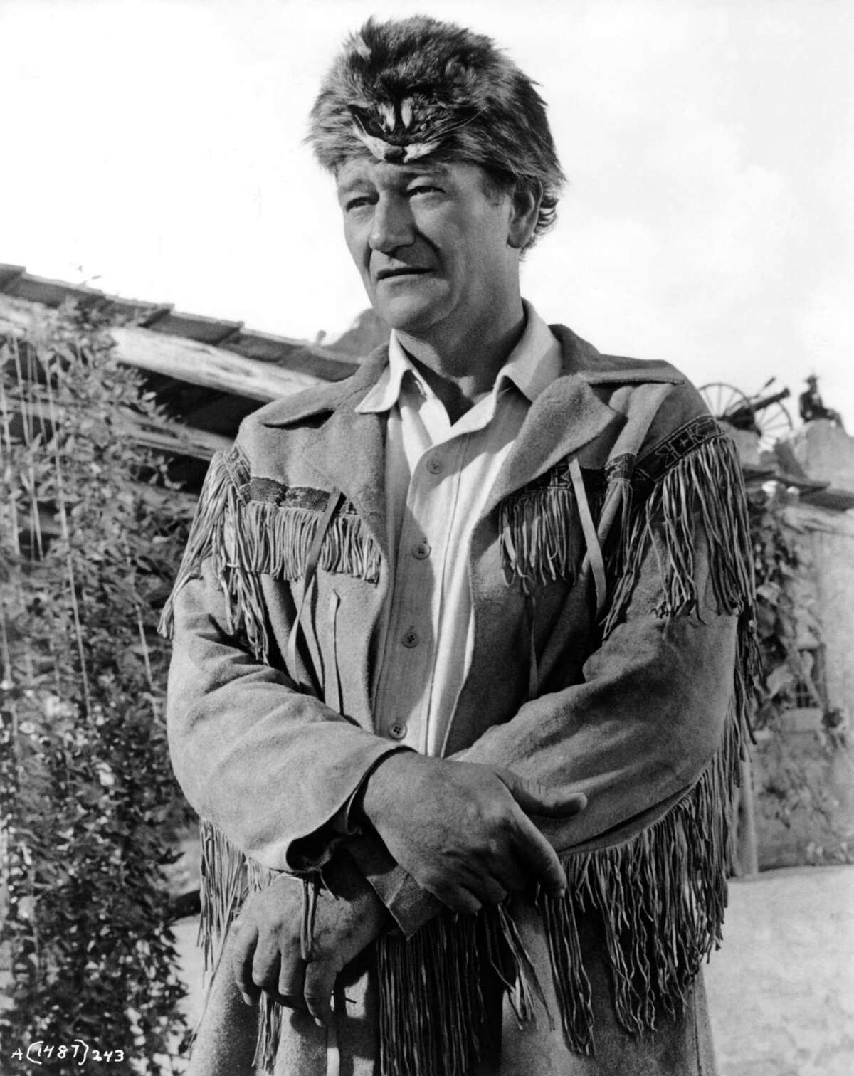 John Wayne is photographed on the set of his movie "The Alamo" in 1960 at the Alamo Village he had built for the film in Brackettville.