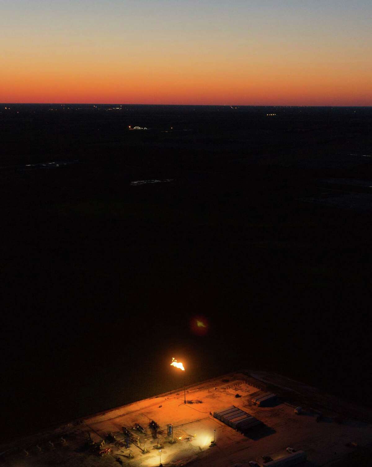 An oil production flare, also called a flare stack, is seen in the Eagle Ford Shale near Karnes City. A yearlong Express-News investigation found that oil and gas companies rushing to drill have burned and wasted billions of cubic feet of natural gas.