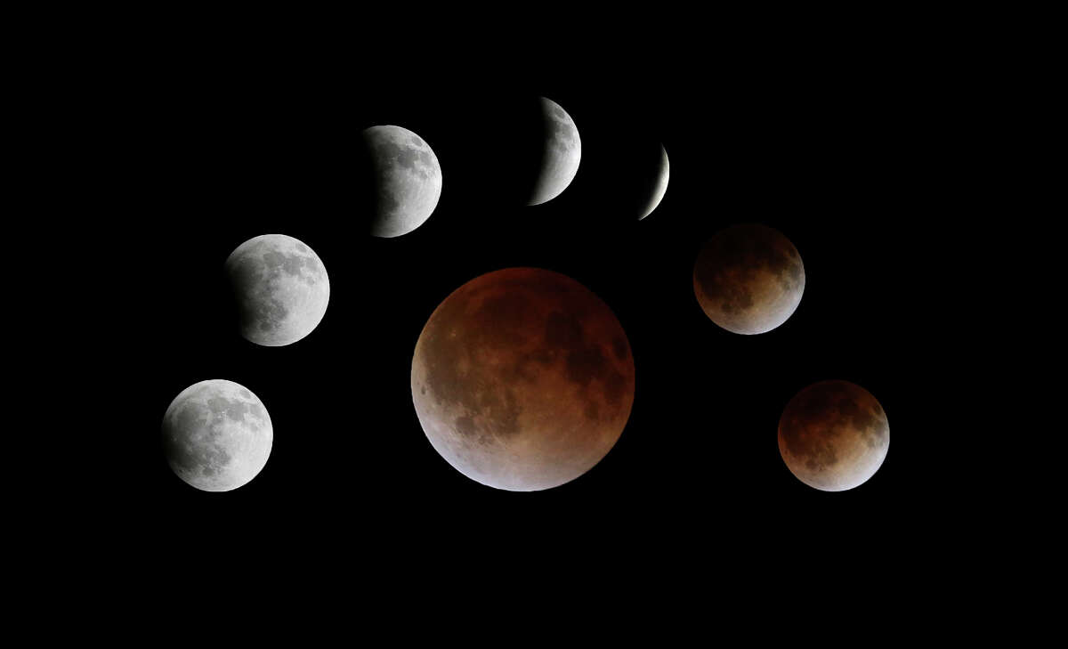 A composite photograph view of the total lunar eclipse "blood moon" Tuesday April 15, 2014.