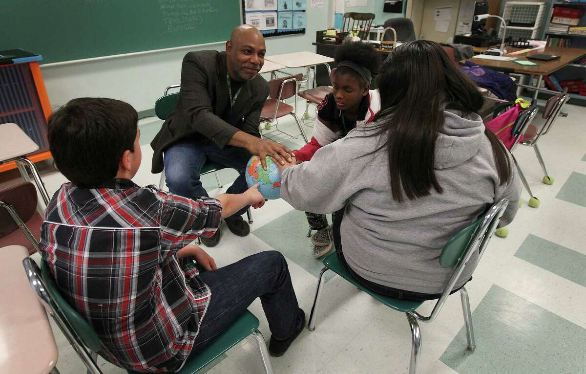 Kitty Hawk Middle School teacher Frederick Ward works with students during a circle session on Tuesday, Dec. 16, 2014. The school will be using restorative discipline starting next year as an attempt to bridge relationships between students and educators to foster a more positive and productive learning environment. Despite not fully utilizing restorative discipline, school officials have already seen marked improvement with student behavior.