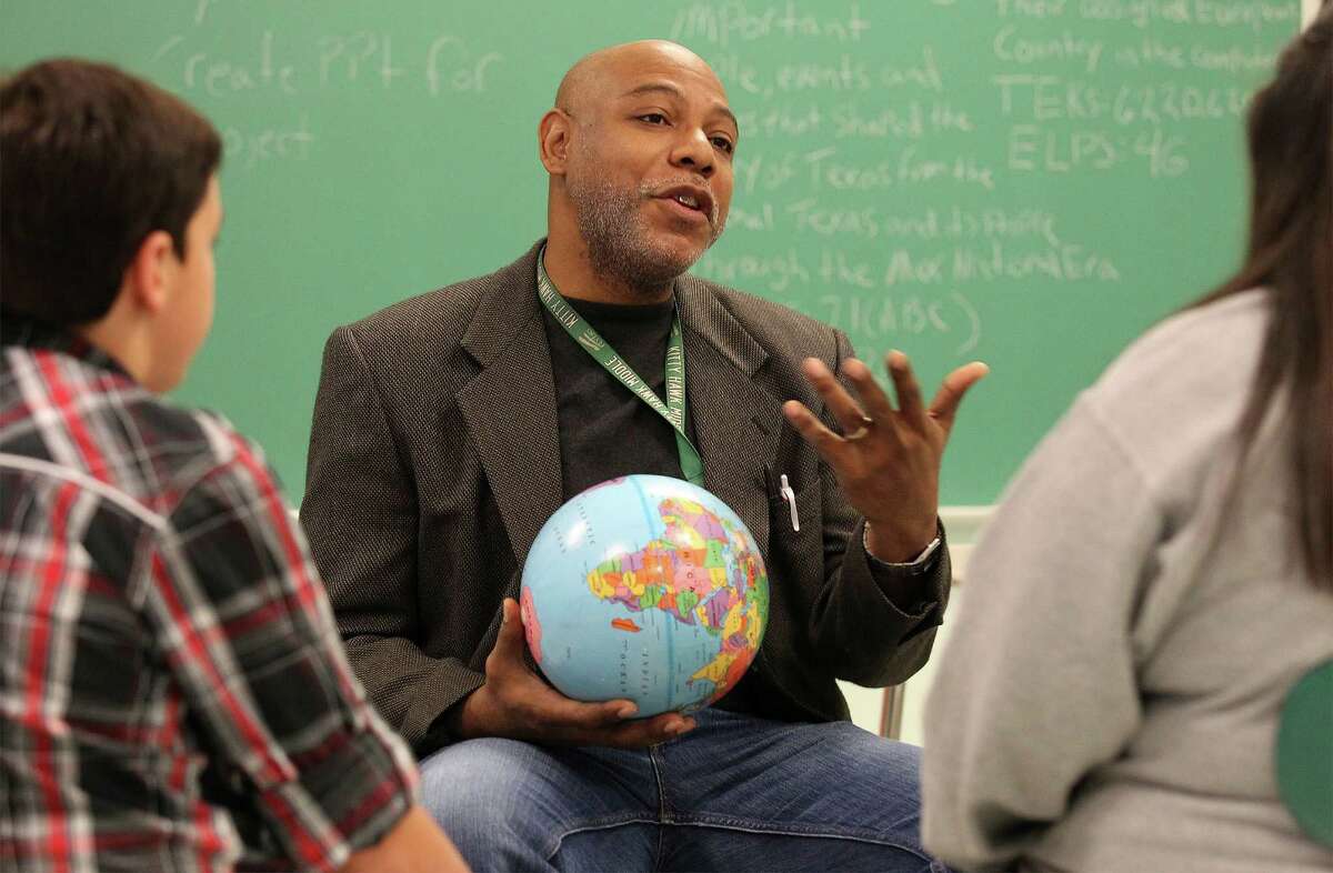 Kitty Hawk Middle School teacher Frederick Ward works with students during a circle session on Tuesday, Dec. 16, 2014. The school will be using restorative discipline starting next year as an attempt to bridge relationships between students and educators to foster a more positive and productive learning environment. Despite not fully utilizing restorative discipline, school officials have already seen marked improvement with student behavior.