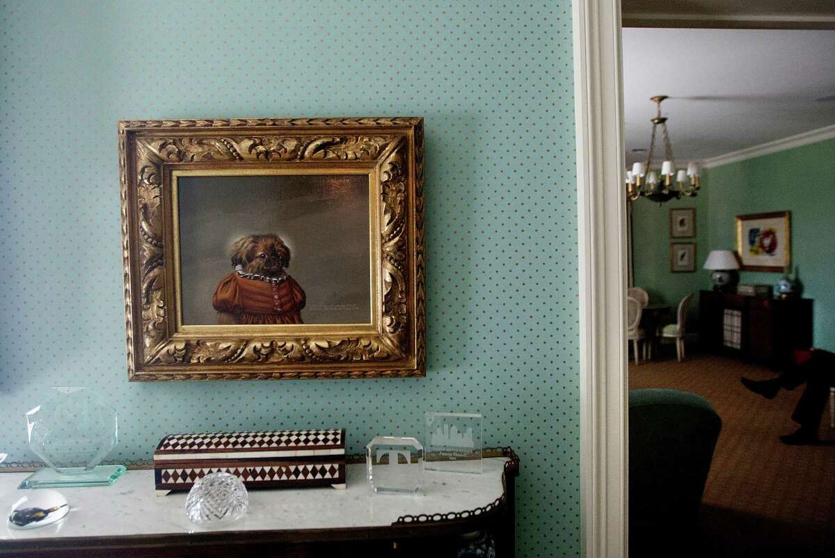 A Donald Roller Wilson painting is hung outside a gathering room at Bradshaw-Carter in one of the many gathering areas in the funeral home in Houston. The funeral home is decorated to feel as if you were at someone's home