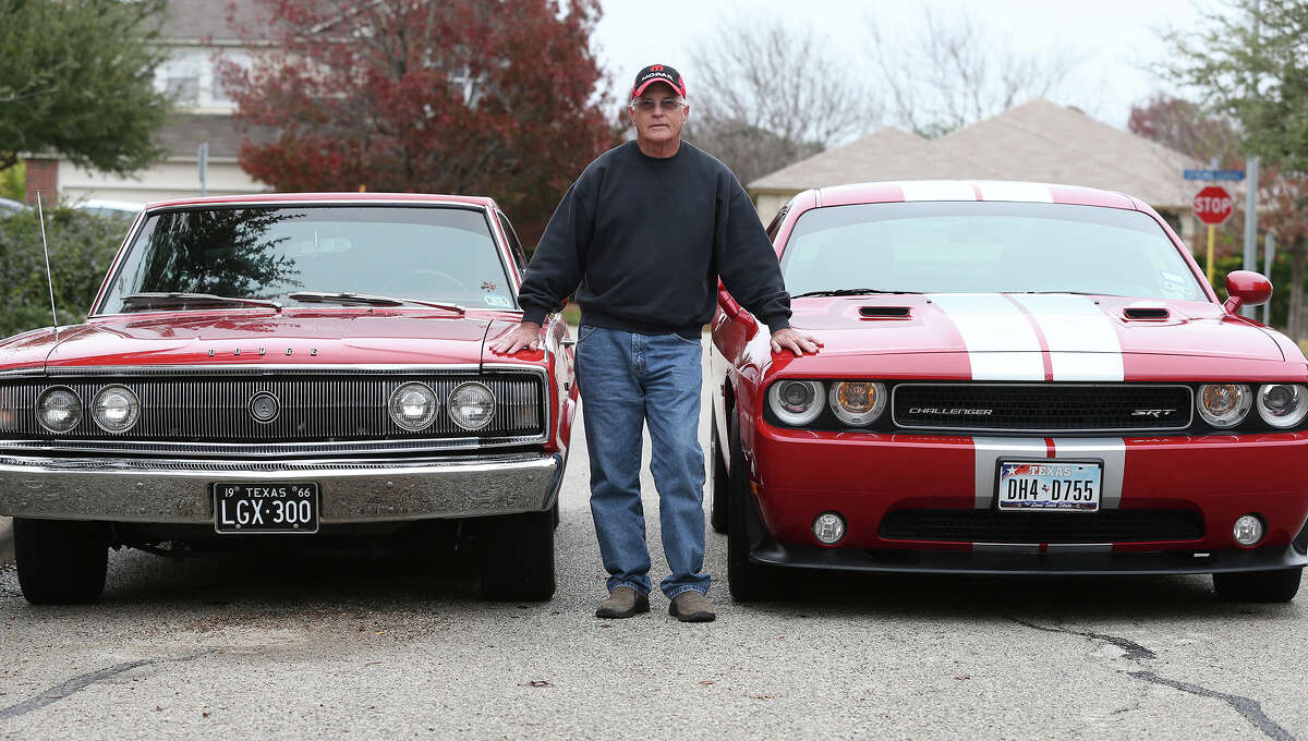 George Culver, standing between his 1966 Dodge Charger and 2012 Dodge Challenger,
