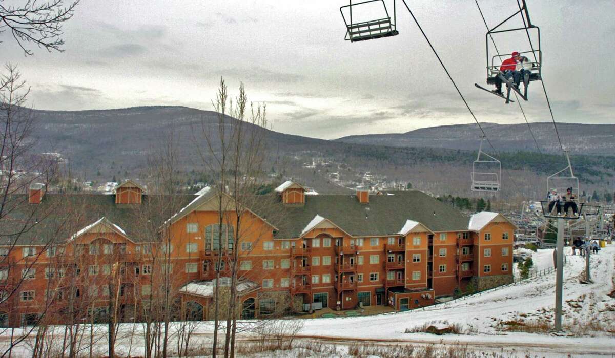 A 2006 file photo showing skiers riding the D chairlift past the Katskill Mountain Club at the base of Hunter Mountain in Hunter, N.Y. A New York City woman died Sunday, Dec. 28, 2014, after falling from the D ski lift at Hunter. (Philip Kamrass/Times Union archive)