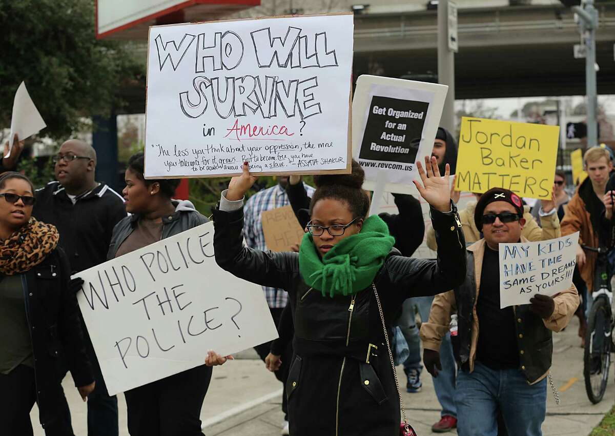 Protesters escorted by HPD walk from SHAPE Community Center - 3903 Almeda - all the way to the "Ferguson, TX" Rally downtown on Monday.