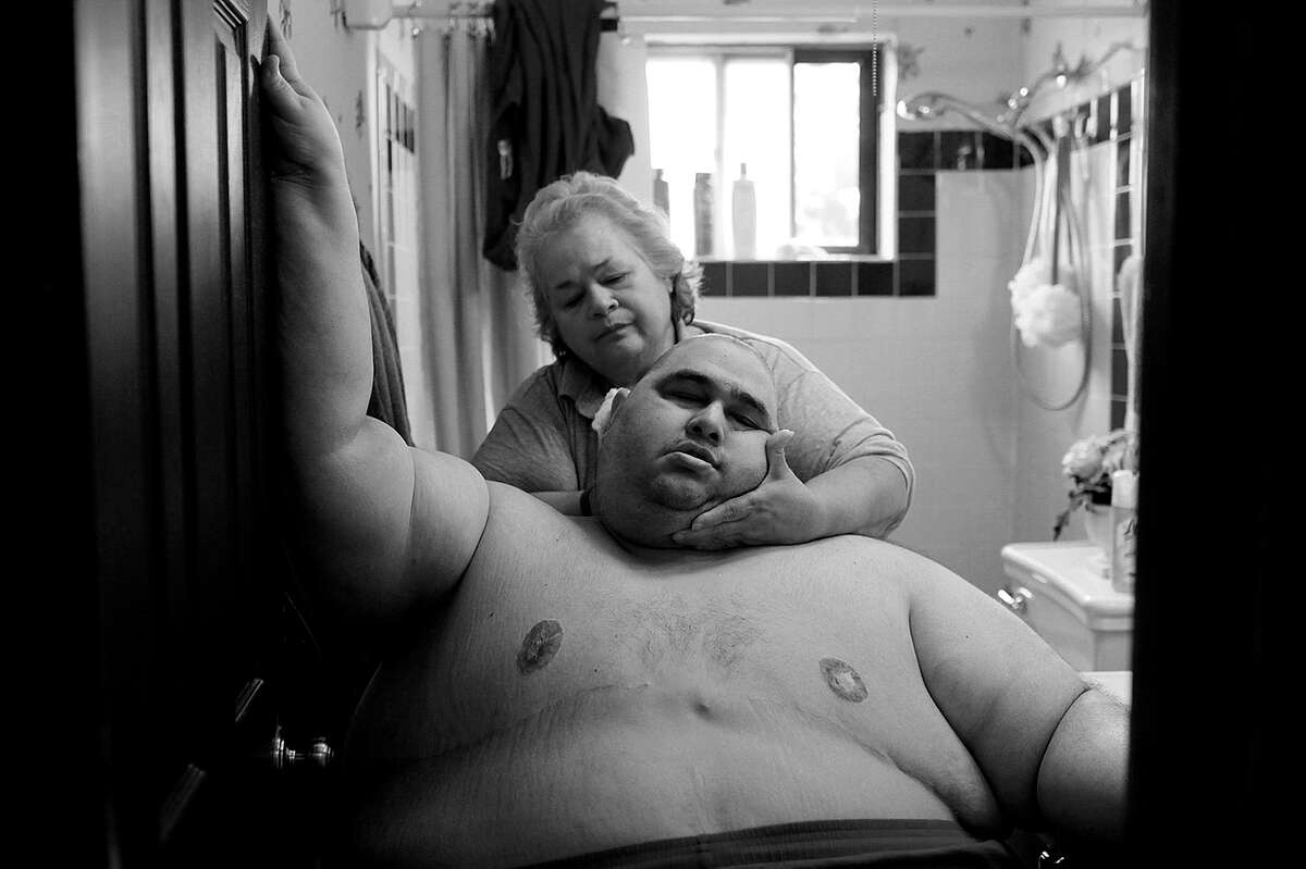 Hector Garcia Jr., seen here with his mother, died before the story about his struggle with obesity appeared in the Express-News.