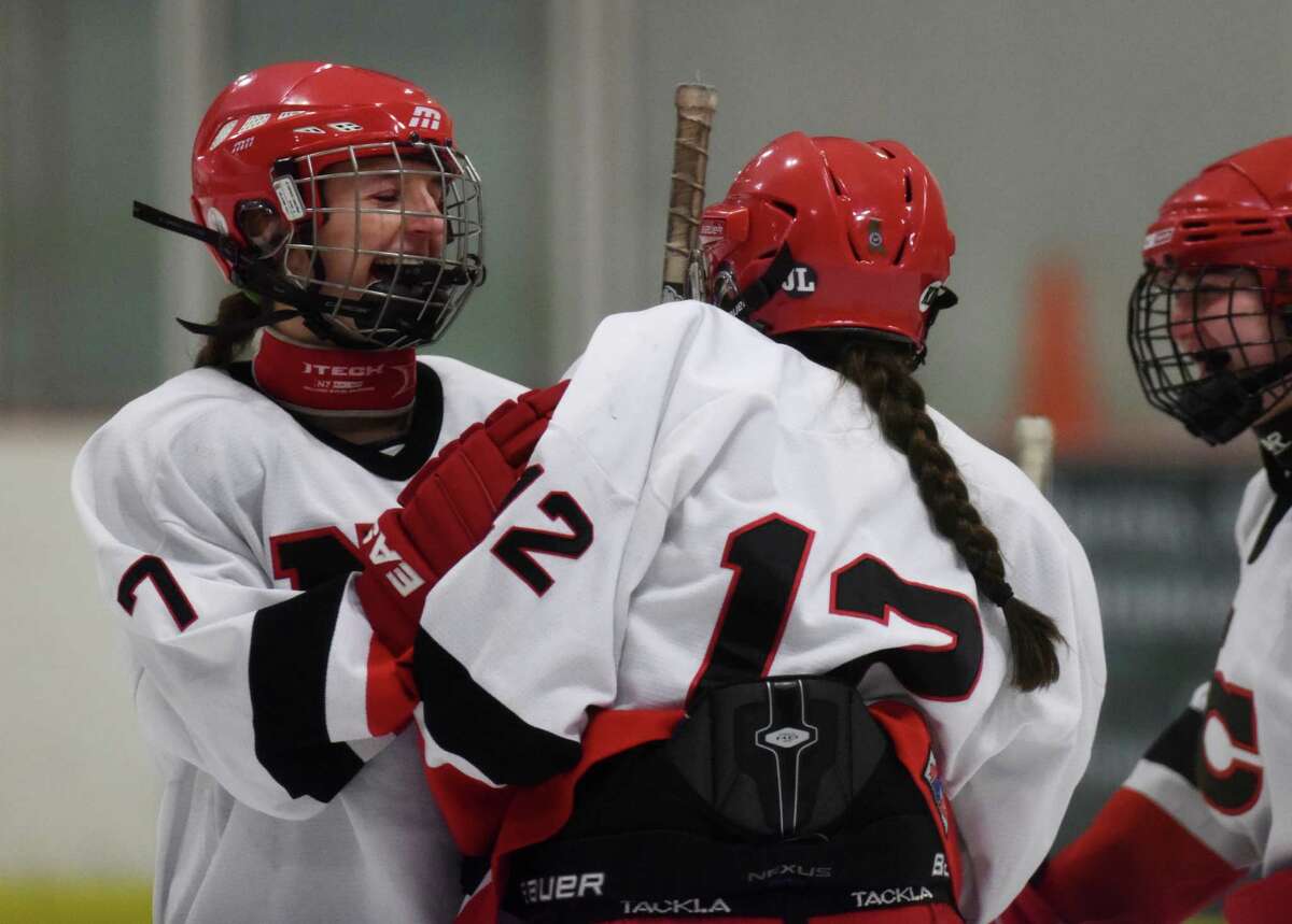 Photos from New Canaan's 6-2 win over Greenwich in the FCIAC high school girls hockey game at the Darien Ice Rink in Darien, Conn. Tuesday, Dec. 30, 2014.