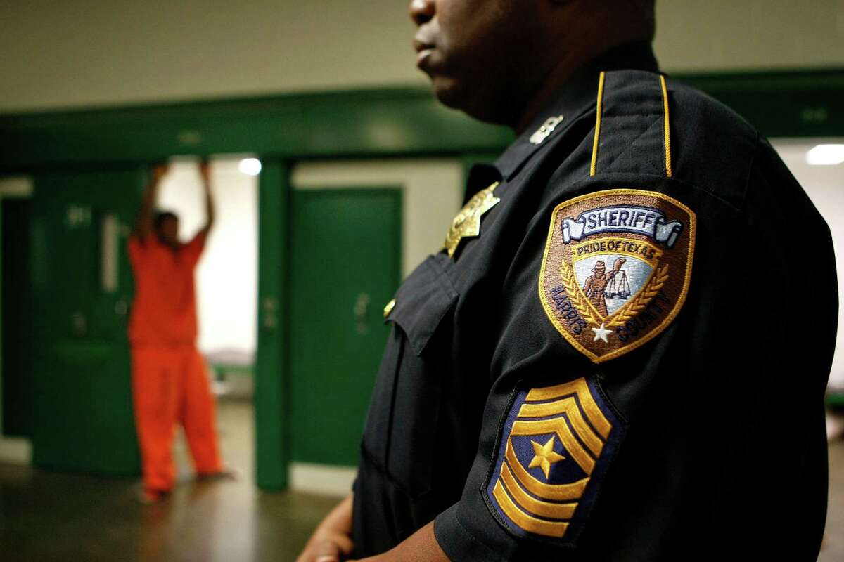 Sgt. Roosevelt Berry looks on as a juvenile stands in his cell at the Harris County Jail on 1200 Baker St. Friday, May 11, 2012, in Houston. The United States has the worldâs largest confined population of adults and youth, and the highest incarceration rates in the world. ( Johnny Hanson / Houston Chronicle )