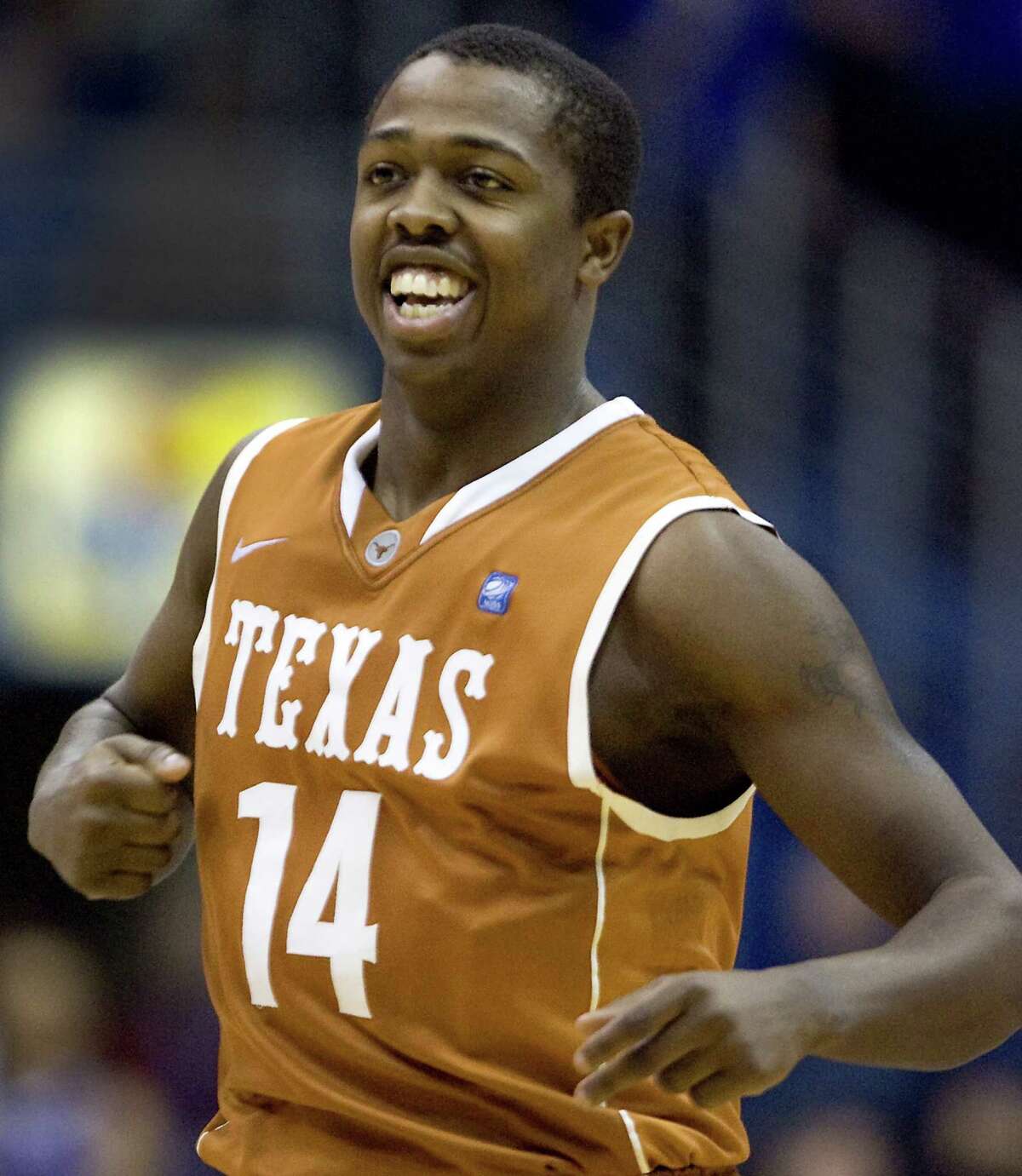 After converting a 3-point shot during Texas' second-half comeback, J'Covan Brown enjoys the moment against Kansas at Allen Fieldhouse in Lawrence, Kansas, on Saturday, January 22, 2011. Brown scored 17 of his game-high 23 points during a 74-63 win that saw Texas rally from 12-point halftime deficit. (Rich Sugg/Kansas City Star/MCT)