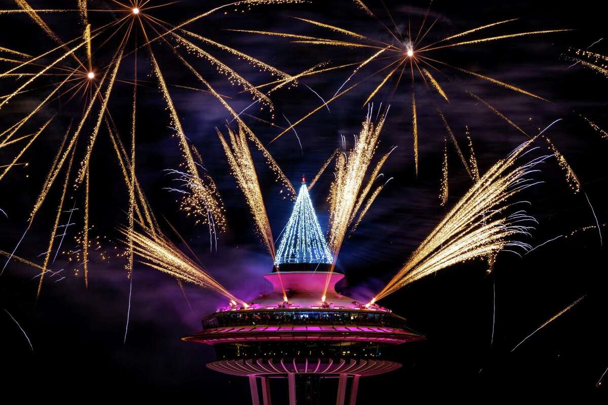 Colorful bursts of fireworks explode along the 605-foot height of the Space Needle during the "T-Mobile New Year?•s Eve at the Needle" event Thursday, Jan. 1, 2015, in Seattle, Washington. The show lasted eight minutes in total and was set to a musical score.