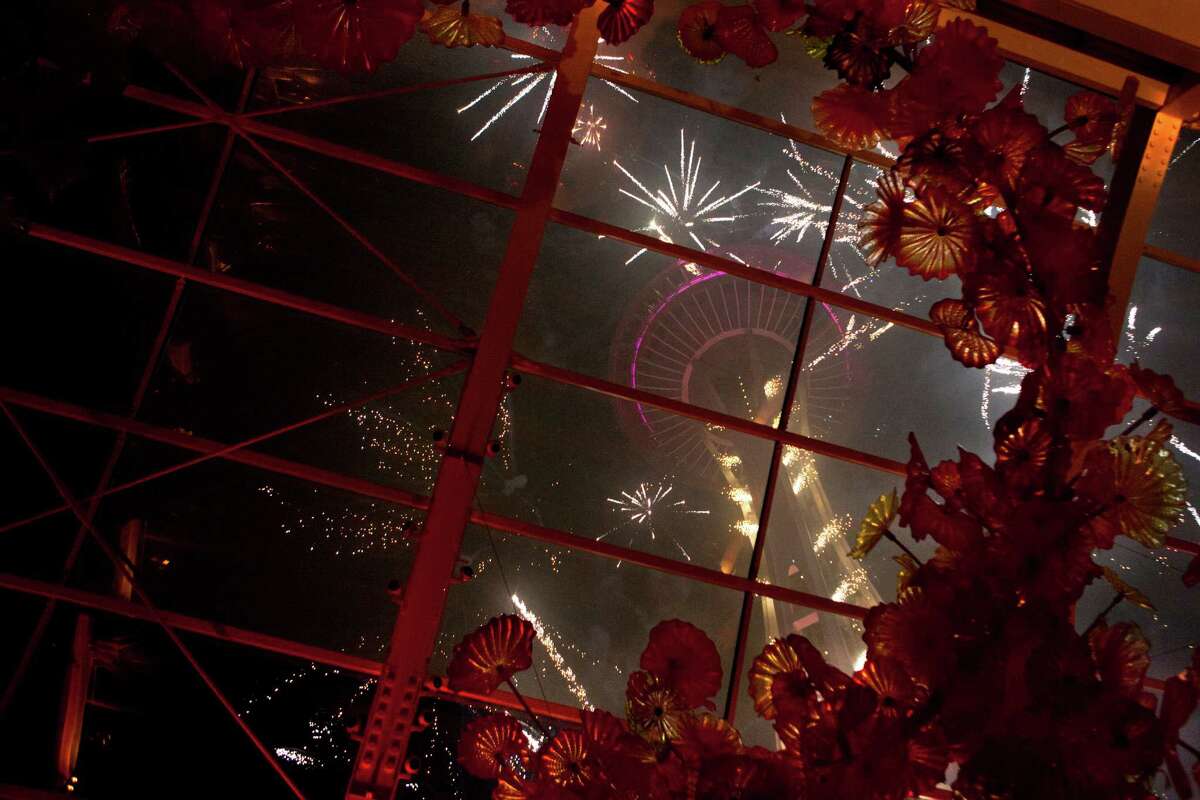 A view of the 2015 New Years Eve fireworks show from inside Chihuly Garden and Glass.
