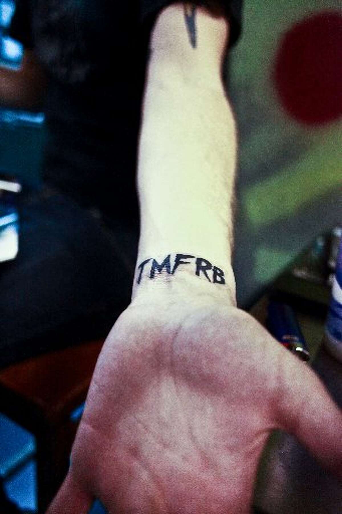 The Ramblin' Boys vocalist Bobby Parrott shows his TMFRB tattoo for their debut EP, TMFRB, that will be released at Tequila Rok on February 16, 2013. Randy Edwards/cat5