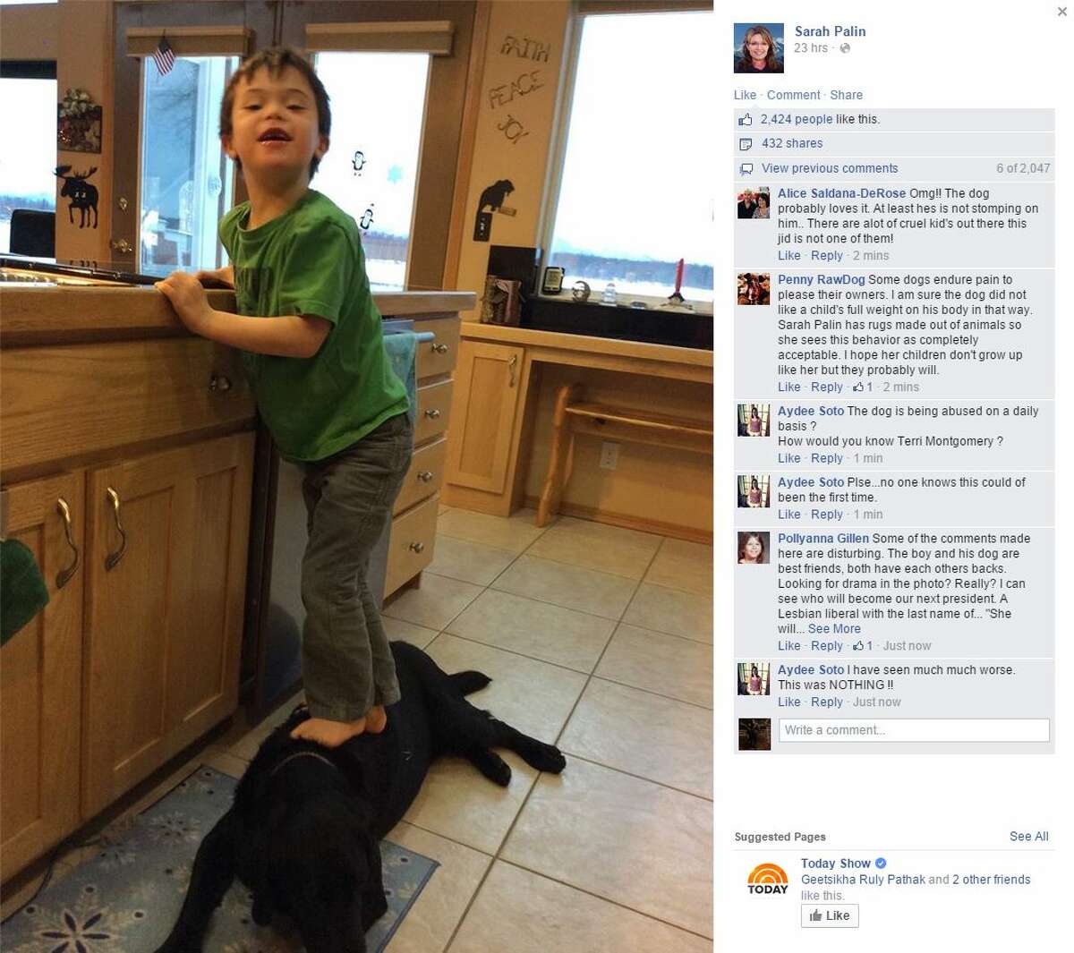 Sarah Palin, former Republican vice presidential candidate, has drawn outrage over a New Year's Day Facebook post showing her son Trig standing on the family dog.