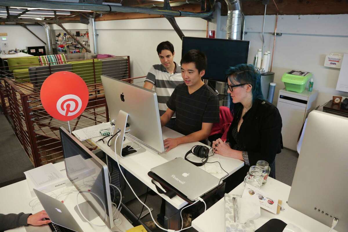 Engineers at work in the offices of Pinterest in San Francisco. The company received $200 million in a funding round last year.