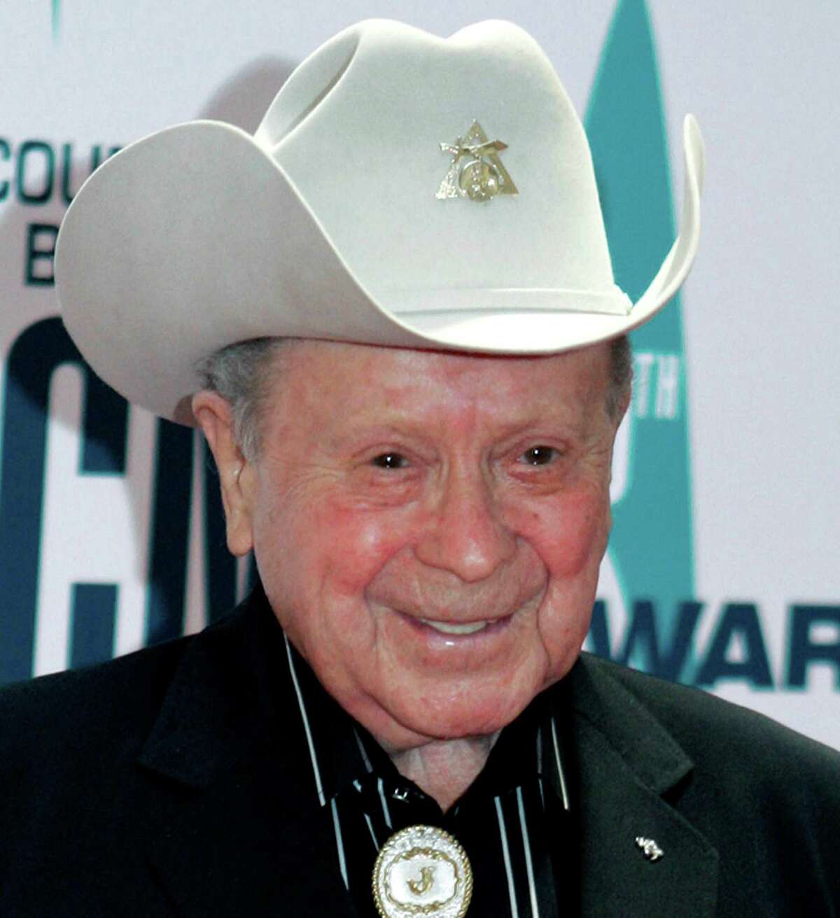 FILE - In this Nov. 6, 2006 file photo, Grand Ole Opry star Little Jimmy Dickens arrives at the 40th Annual CMA Awards in Nashville, Tenn. Dickens has been hospitalized with an undisclosed illness. Jessie Schmidt, a publicist for the Opry, said in a news release Sunday, Dec. 28, 2014, that Dickens was admitted to a Nashville-area hospital on Dec. 25 and that he's in "critical care." (AP Photo/Chitose Suzuki, File)