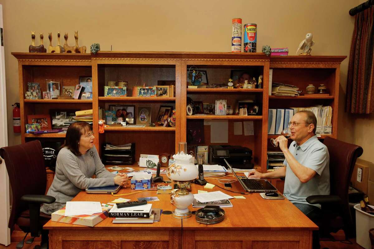 Paul and Michelle Zygielbaum share an office and a desk space where they can talk at their Santa Rosa, Calif. home Wednesday December 17, 2014. Paul Zygielbaum was diagnosed with mesothelioma because of asbestos exposure in 2003. He is determined to make the public aware of the asbestos in products even today.