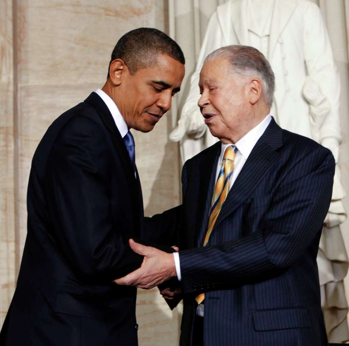 File-This Oct. 28, 2009, file photo shows President Barack Obama greeting former Massachusetts Sen. Edward Brooke in the Rotunda on Capitol Hill in Washington, during a ceremony where Brooke received the Congressional Gold Medal. Brooke, the first black to win popular election to the Senate, has died. He was 95. Ralph Neas, a former aide, said Brooke died Saturday, Jan. 3, 2015, of natural causes at his Coral Gables, Fla, home. (AP Photo/Gerald Herbert, File)