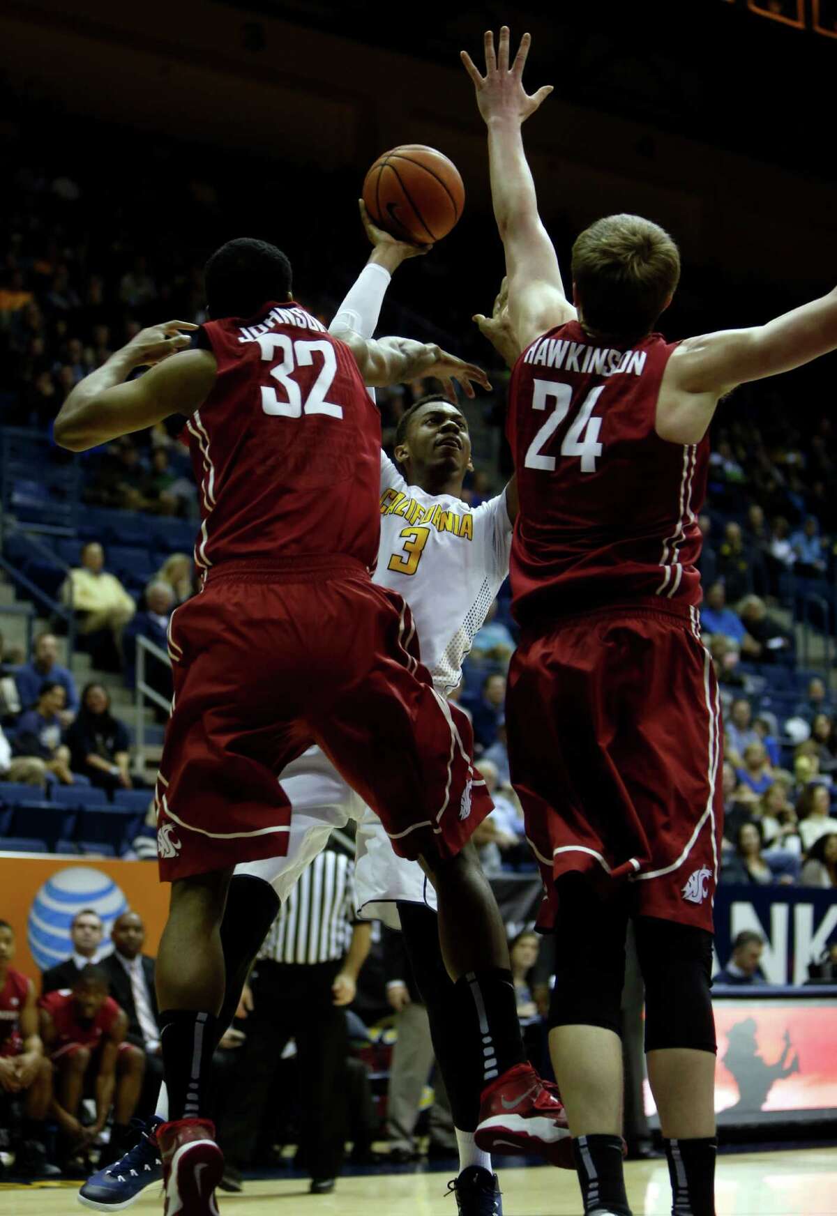 Cal’s Tyrone Wallace, who scored 16 points, looks for shooting room against Que Johnson (32) and Josh Hawkinson.
