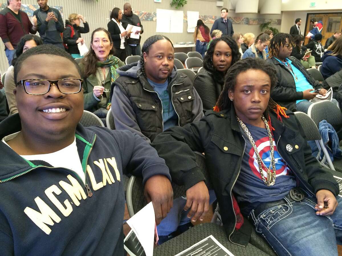 Kendrick Martin, a 19-year-old CCSF student in the first row, left, and Demond Martin, 19, at right in the first row, are seen at a community symposium on race and other issues at City College of San Francisco on Sunday, Jan. 4, 2015. They said they want more job opportunities for young people in Bayview-Hunters Point.