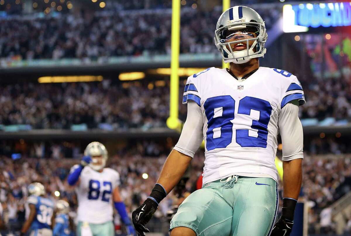 Terrance Williams celebrates after scoring a touchdown against the Detroit Lions during the second half.