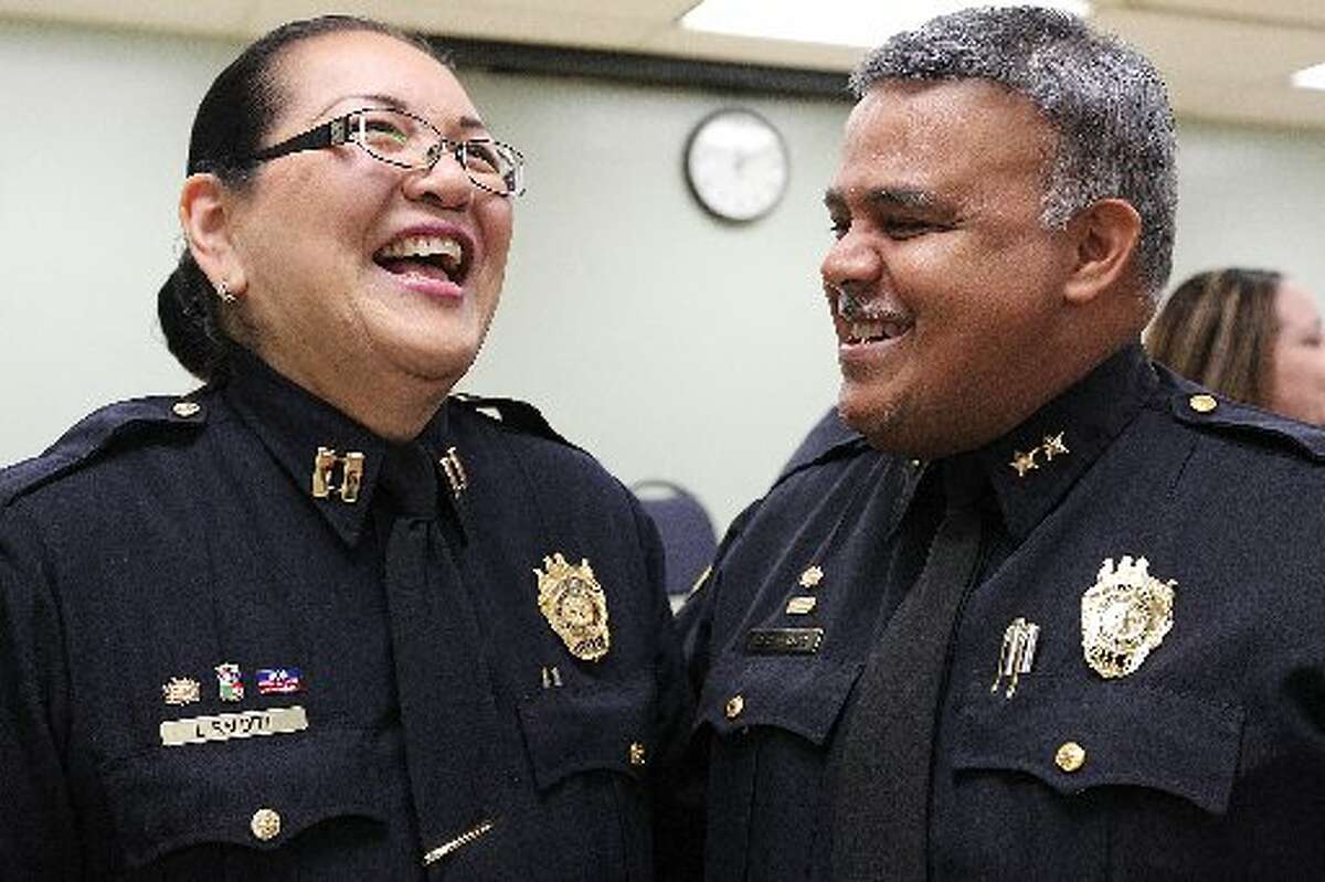 Captain Laura Balditt shares a laugh with Jail Administrator Deputy Chief Raul S. Banasco after her promotion during a ceremony at the Bexar County Jail, Monday, Jan. 5, 2015. Balditt is the first woman to achieve the rank in the detention's history. Balditt started working at the detention center as a civilian employee in February 1987. She became a detention officer in 1992 and was promoted to lieutenant in 2002.