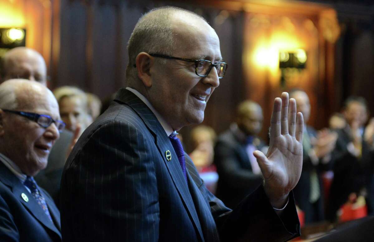 State Sen. Andrew Maynard, D-Stonington, injured in a fall in July, returned to the Senate on the opening day of legislature Wednesday, Wednesday, Jan. 7, 2015, in the state Senate chamber in Hartford, Conn.