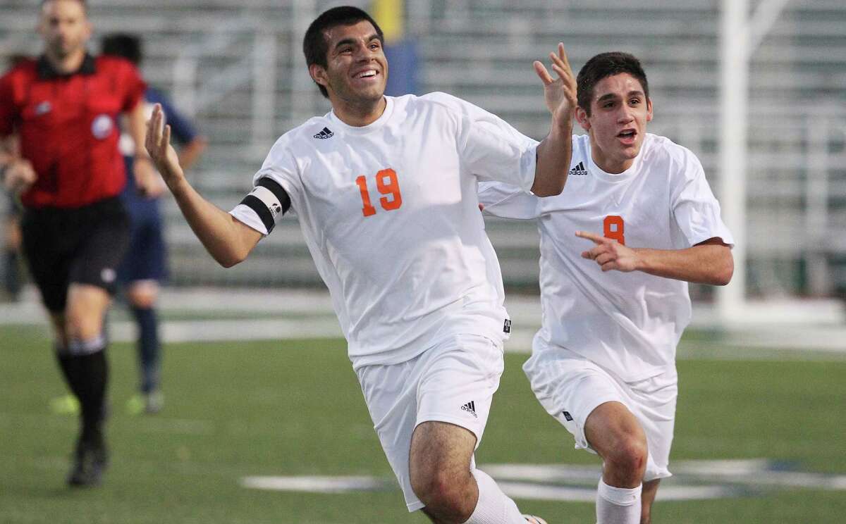 Brandeis’ Patricio Botello-Faz (left) celebrates along with teammate Cameron Gutierrez after scoring the game’s first goal against O’Connor during their Region IV quarterfinal match at Farris Stadium on April 8, 2014. The Broncos start off the 2015 season as the No. 1 team in the Express-News Area rankings.