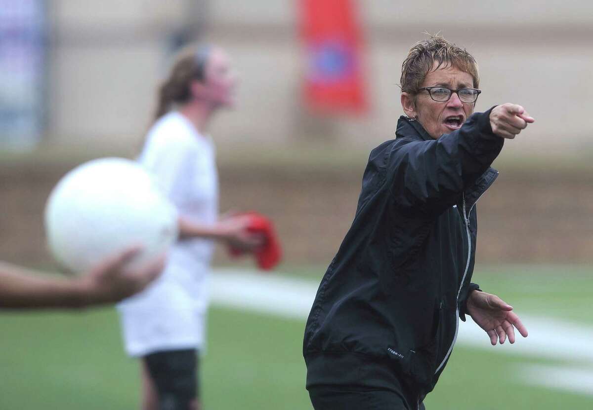Reagan girls soccer coach Frankie Whitlock asks for clarification from an official during a Class 5A state semifinal match against Plano West in 2014.