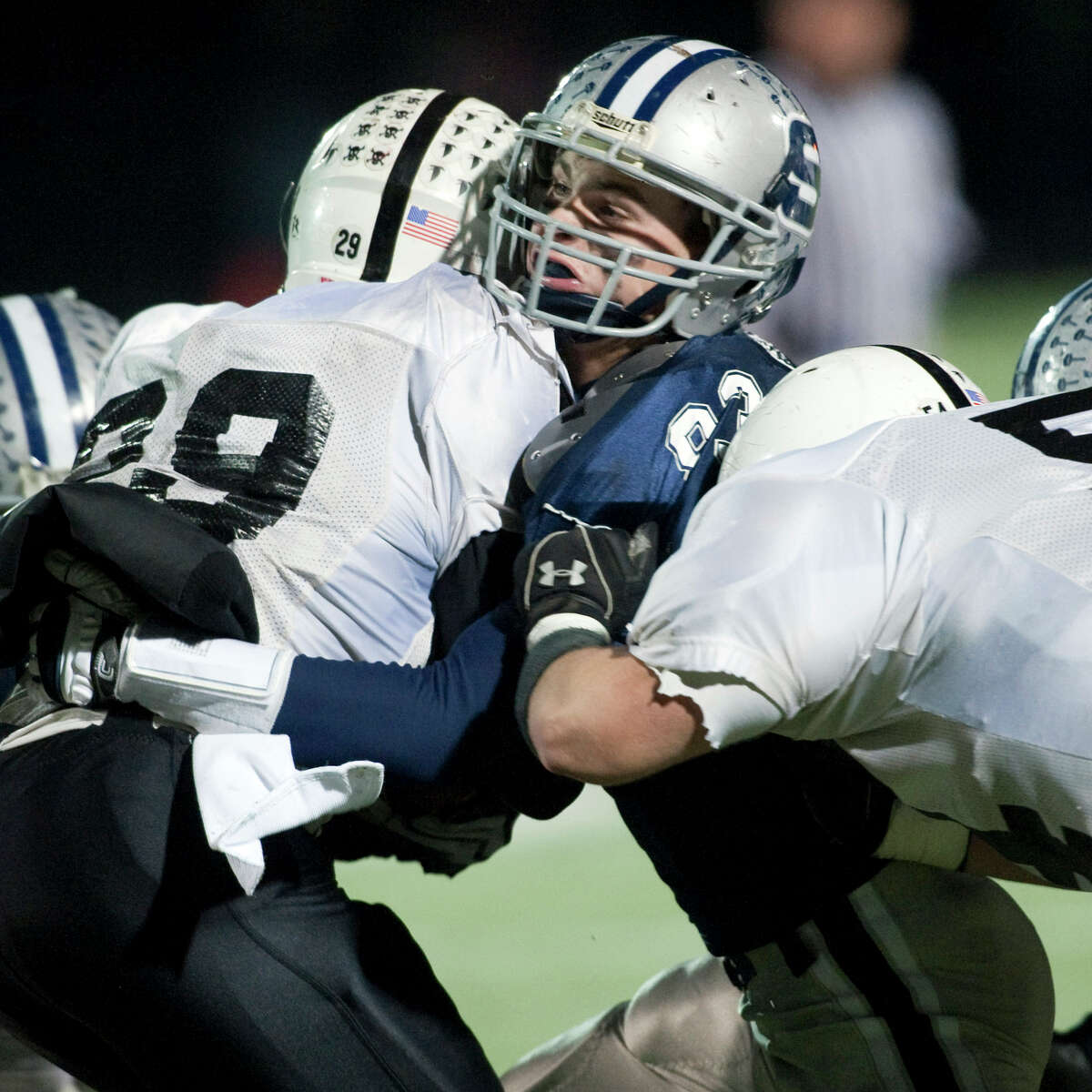 Chris Coyne, playing football for Westport's Staples High School during a playoff game on Dec. 1, 2009. Coyne, a senior at Yale University suffered multiple concussions. The last one, at Yale, ended his playing career.