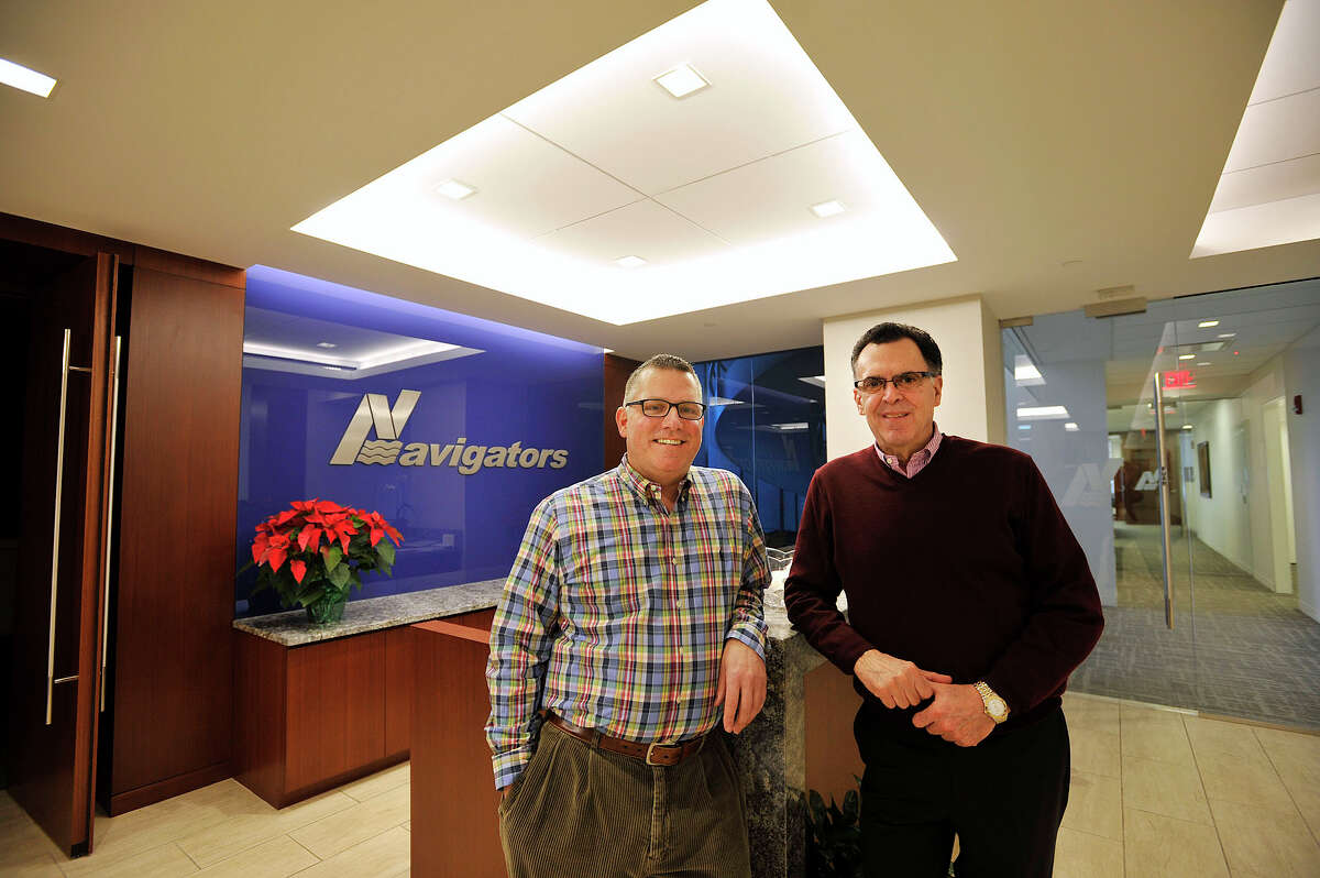 Vincent Sampieri, left, assistant vice president of Navigators, and Thomas Izzo, senior real estate manager at 400 Atlantic Street, pose in their building in Stamford, Conn., on Wednesday, Dec. 24, 2014. Navigators recently leased space at 400 Atlantic Street illustrating a trend in companies leasing more green, or energy efficient, office spaces.