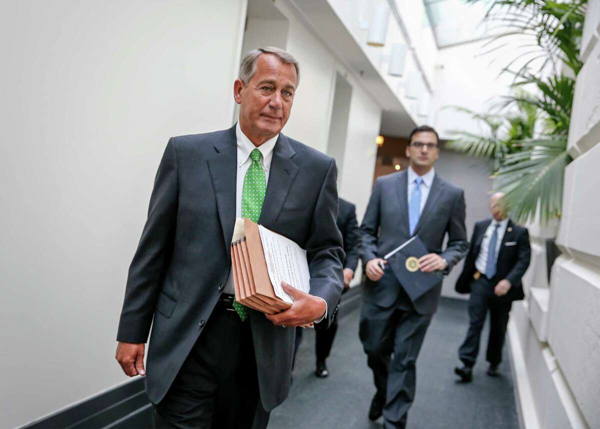 House Speaker John Boehner of Ohio walks to a closed-door meeting with House Republicans, Wednesday, Jan. 7, 2015, on Capitol Hill in Washington. (AP Photo/J. Scott Applewhite)
