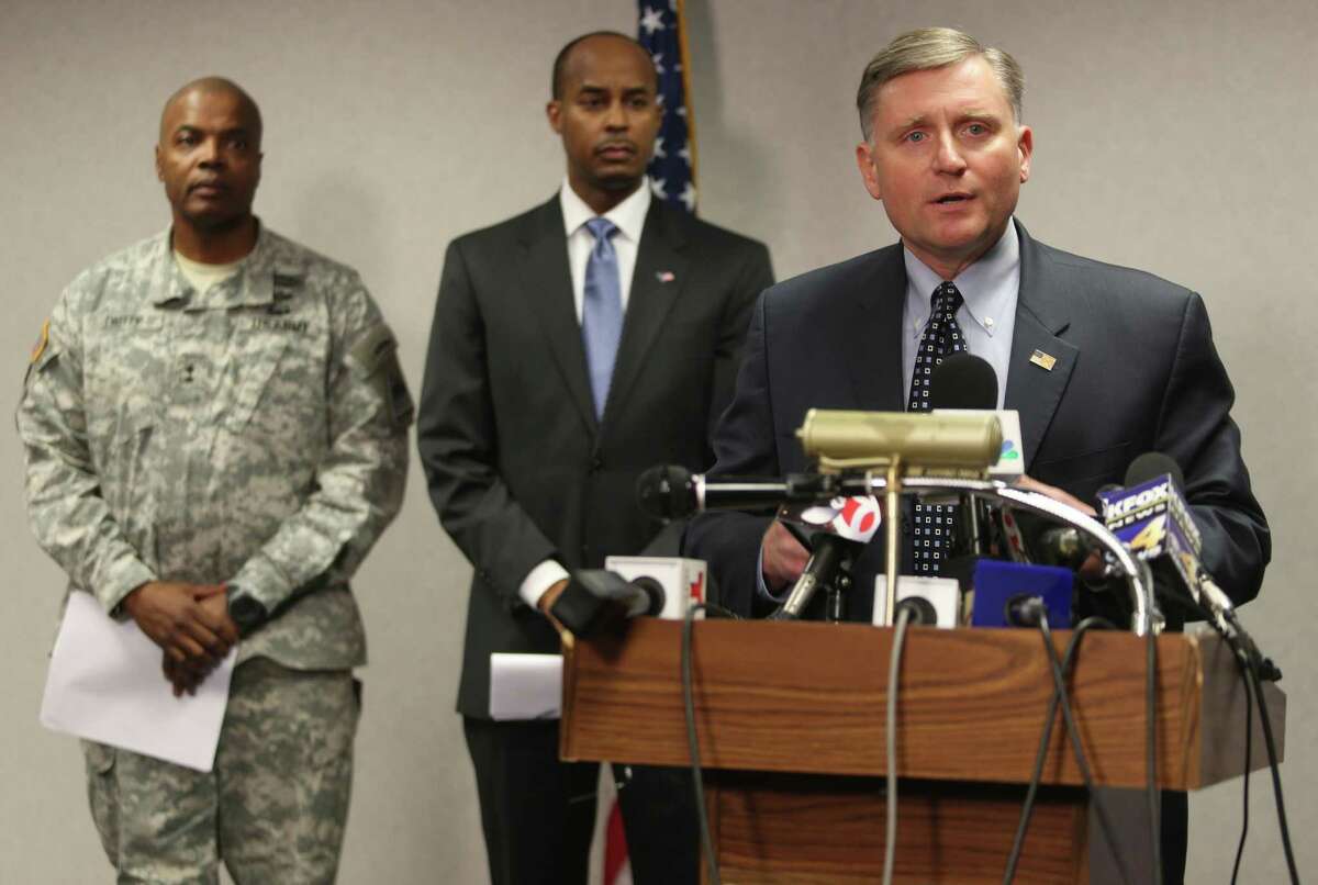 Douglas Lindquist, FBI Special Agent in Charge of the El Paso office, right, speaks during a news conference Wednesday, Jan. 7, 2015, in El Paso, Texas. The FBI identified the gunman in Tuesday's shooting as Jerry Serrato, who was medically discharged from the Army in 2009 after serving in Iraq two years earlier. (AP Photo/The El Paso Times, Victor Calzada)