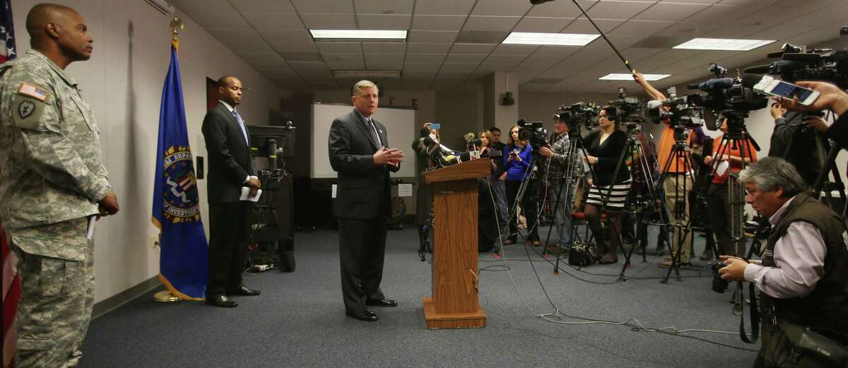 Douglas Lindquist, center, FBI Special Agent in Charge of the El Paso office, spoke Wednesday Jan. 7, 2015 about a murder/suicide at the El Paso VA Tuesday in El Paso, Texas. Fort Bliss commander Stephen Twitty is at left, and Acting Director of the El Paso VA Health Care System Peter Dancy is right of Twitty. (AP Photo/El Paso Times, Victor Calzada)