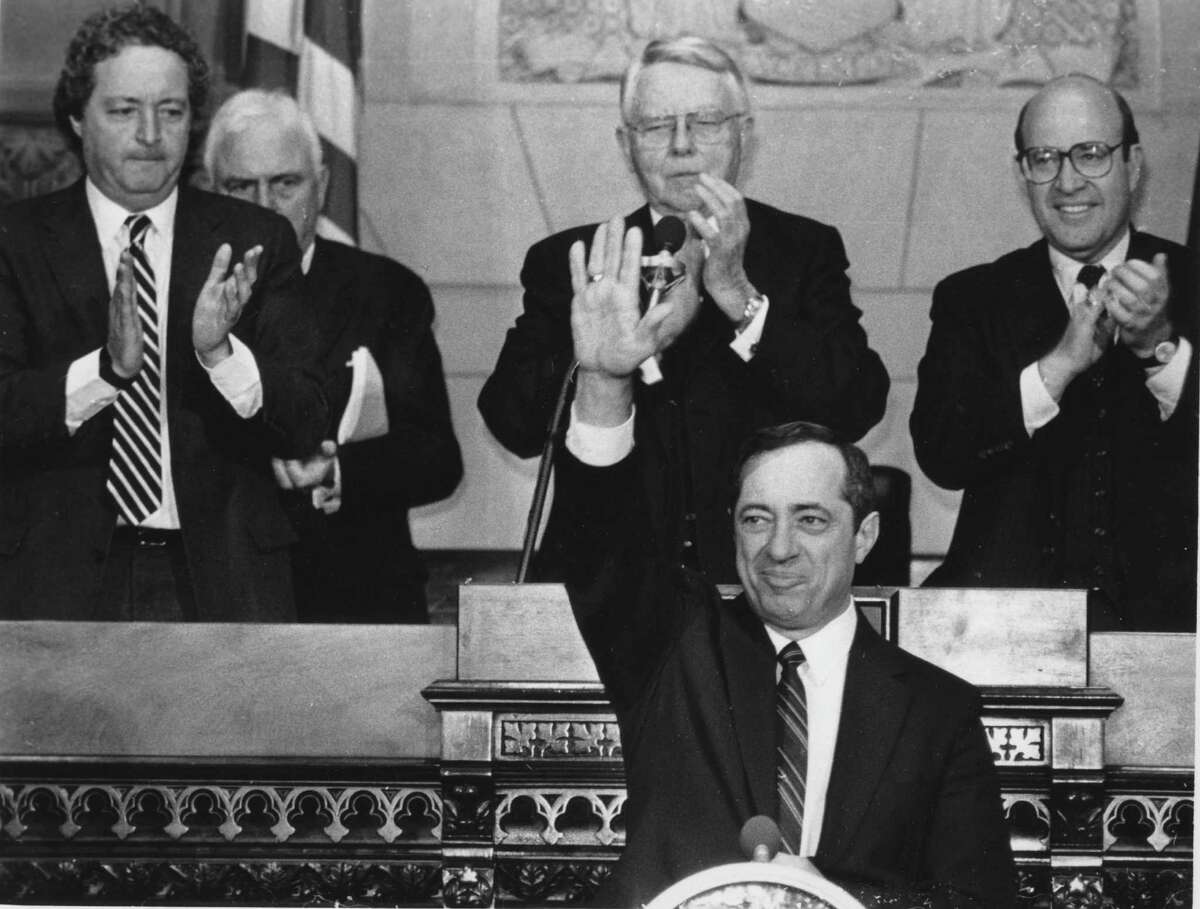 Gov. Mario Cuomo waves to the legislature during the annual state of the state address Jan. 8, 1986, at the Capitol in Albany, N.Y. On the back row are: Speaker Stanley Fink, left, Rev. Bruner, Senate majority leader Warren Anderson, and state attorney general Robert Abrams, right. (Bob Richey/Times Union archive)