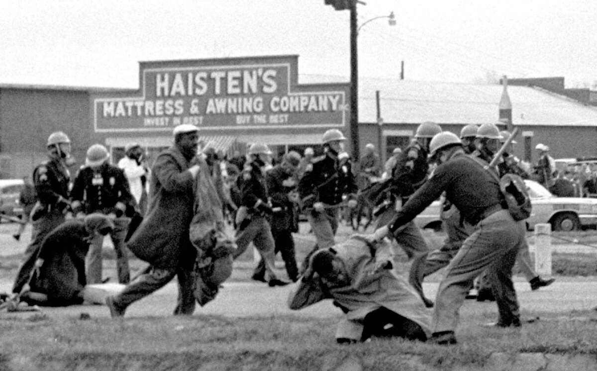 That first march to Montgomery, on March 7, 1965, came to be known as "Bloody Sunday": Armed troopers attacked more than 600 freedom marchers that day. Here: State troopers attack marchers with billy clubs.